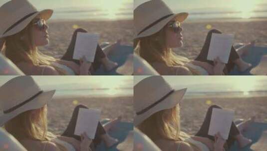 日落时在海滩上看书的女人高清在线视频素材下载