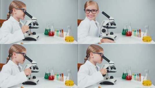 女孩使用显微镜观察实验现象并对着镜头微笑高清在线视频素材下载