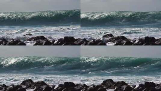蓝色的波浪以慢动作滚进海岸高清在线视频素材下载