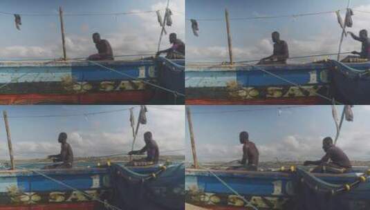 渔民在船上拉绳索高清在线视频素材下载