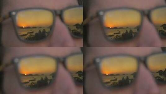 眼镜里的日落景观高清在线视频素材下载