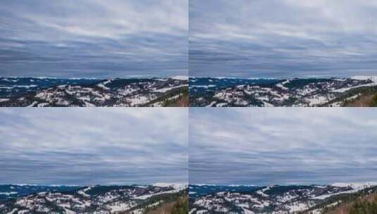 冬天森林覆盖的山上多云的天空高清在线视频素材下载