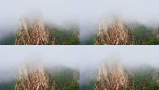 云雾中的黄山风景区航拍奇山怪石高清在线视频素材下载