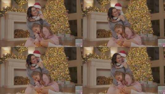 圣诞树旁拥抱妈妈的孩子们高清在线视频素材下载