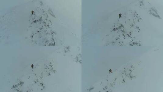 登山者穿越积雪的岩石表面高清在线视频素材下载