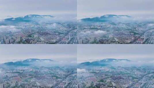 九江市低空云雾下的城市及庐山剪影航拍延时高清在线视频素材下载