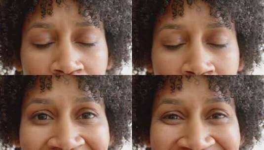 一个卷发和棕色眼睛的混血儿女人的特写镜头高清在线视频素材下载