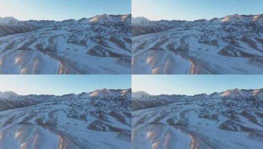 航拍冬季新疆赛里木湖雪山冰湖蓝冰日照金山高清在线视频素材下载