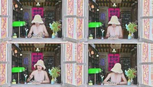 一位中国温柔美女女士坐在窗前用笔书写日记高清在线视频素材下载