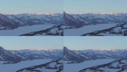 航拍新疆冬季喀纳斯河流晨雾雪山森林雪景高清在线视频素材下载