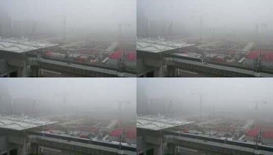 上海外高桥秋天晨雾地铁站与建设工地塔吊高清在线视频素材下载
