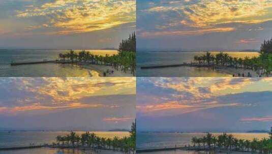 海南海边沙滩码头椰树度假游人夕阳日落延时高清在线视频素材下载