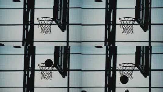 篮球环的轮廓，球击中篮筐。在室内打篮球高清在线视频素材下载