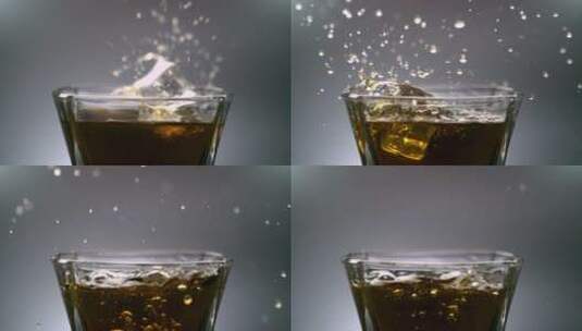 HD高速摄影旋转冰块落入酒里高清在线视频素材下载