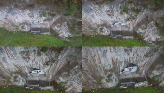 4k航拍云南山区悬崖峭壁山洞里的人家高清在线视频素材下载
