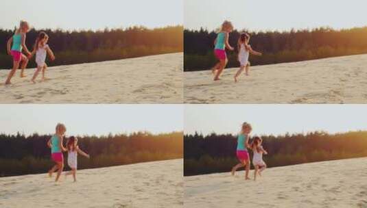 日落两个快乐的女孩在沙滩奔跑高清在线视频素材下载
