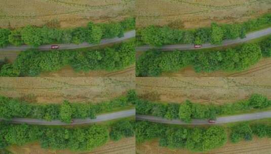 行驶在乡村公路的小车航拍景观高清在线视频素材下载