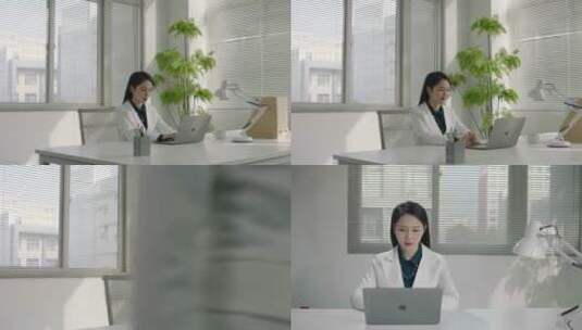 女白领办公室内操作笔记本高清在线视频素材下载