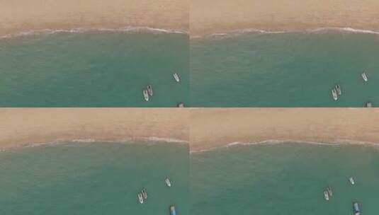 俯拍沙滩海浪游船大海高清在线视频素材下载