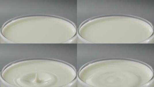 拍摄一滴牛奶落到液面创意视频高清在线视频素材下载
