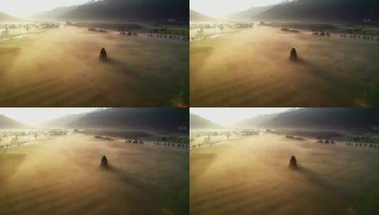 山区河谷草地平原腹地晨雾航拍高清在线视频素材下载