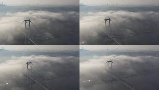 土耳其伊斯坦布尔雾天博斯普鲁斯海峡大桥的航拍视频。7月15日烈士桥03高清在线视频素材下载