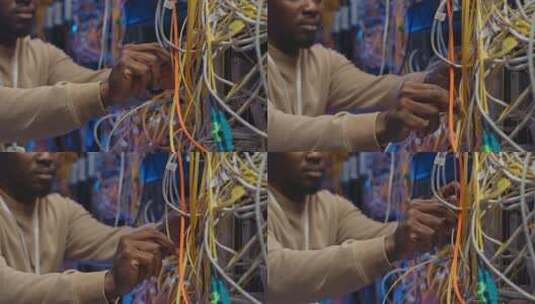 非裔美国IT工程师连接服务器电线高清在线视频素材下载