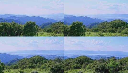 夏季蓝天白云绿色大山山顶全景风光高清在线视频素材下载