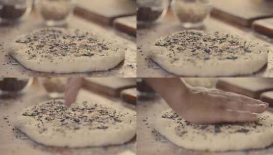 面包师将香料撒到面饼上高清在线视频素材下载