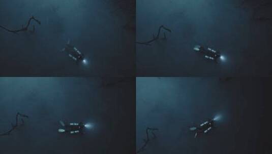 潜水员拿着探照灯在海底探险 高清在线视频素材下载
