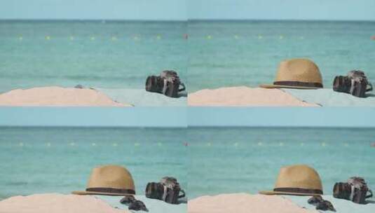 海滩上的太阳帽太阳镜高清在线视频素材下载
