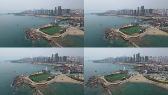 4K 航拍青岛海岸线绿色足球场高清在线视频素材下载