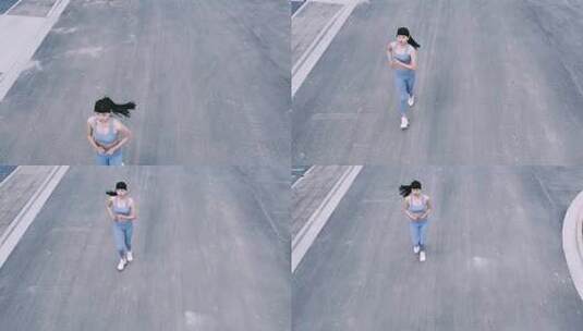 航拍运动装女性城市街头跑步运动高清在线视频素材下载