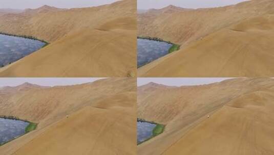 航拍沙漠沙脊上行走的人高清在线视频素材下载