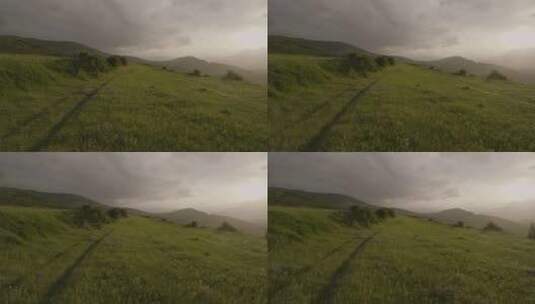 佐治亚州乌云密布的高地上的绿色草地。空中撤退高清在线视频素材下载
