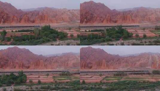 航拍新疆库车红山石林下行驶的火车高清在线视频素材下载