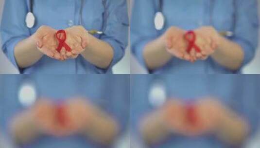 蓝衣女妇科医生手掌握红丝带，艾滋病意识高清在线视频素材下载