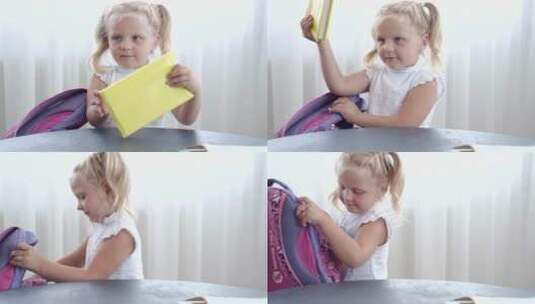 女孩把一本书放到了书包里高清在线视频素材下载