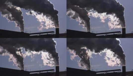 工厂的两个烟囱里冒出滚滚浓烟高清在线视频素材下载