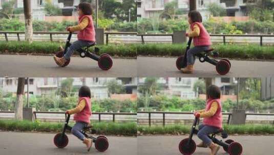 公园里骑三轮车的小女孩高清在线视频素材下载