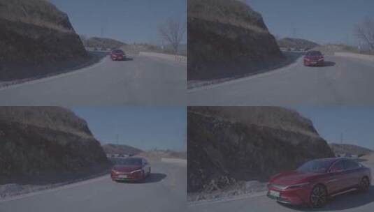 红色新能源电动汽车在山路 s弯道转弯 跟拍高清在线视频素材下载