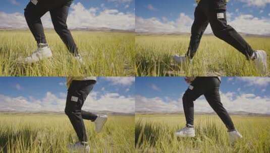 慢动作拍摄男人在秋天的草原上奔跑高清在线视频素材下载
