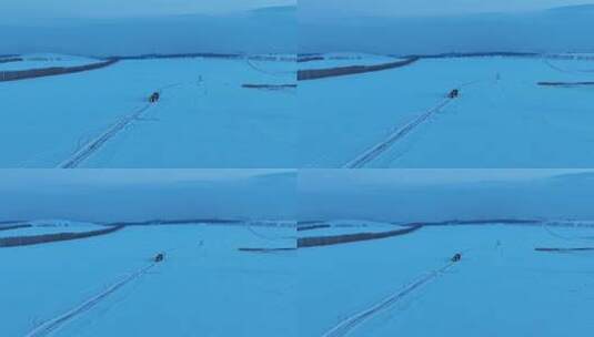 垦区田野冰雪道路上的汽车高清在线视频素材下载