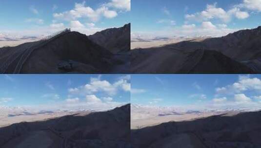 航拍新疆南疆帕米尔高原盘龙古道苍凉景色高清在线视频素材下载