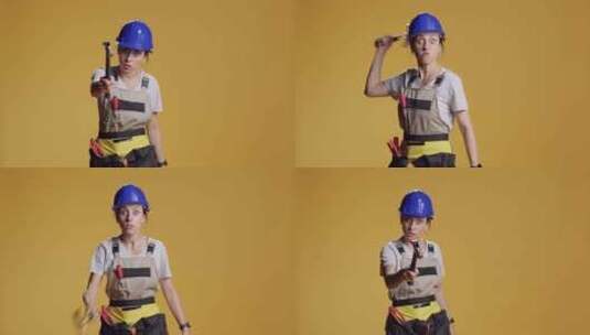 女性建筑工人用锤子危险行事高清在线视频素材下载