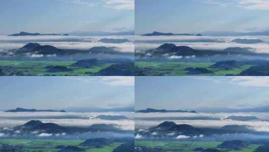 清晨云雾缭绕的火山大地绿色农田高清在线视频素材下载