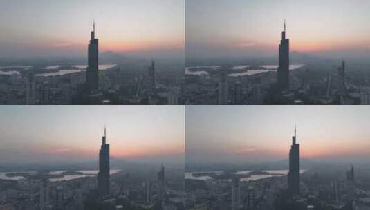 日出时分的江苏南京紫峰大厦玄武湖航拍高清在线视频素材下载