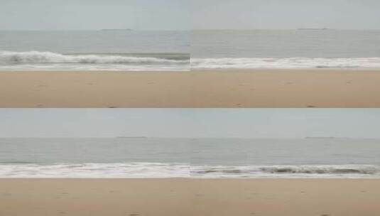 竖屏阴天海边清澈的海水拍打在沙滩上高清在线视频素材下载