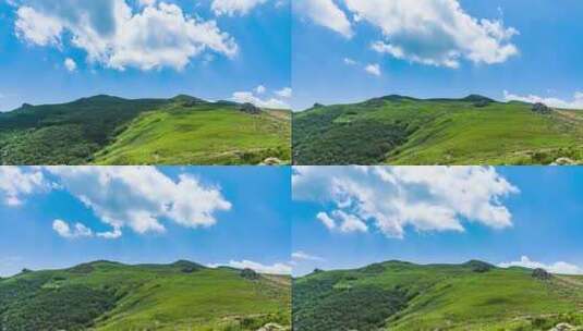 夏季蓝天白云绿色高山草甸群山大气风光高清在线视频素材下载