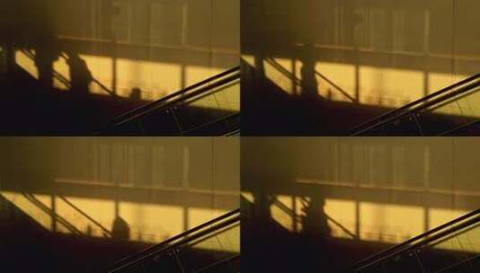 金色光影下的电动扶梯剪影光影高清在线视频素材下载